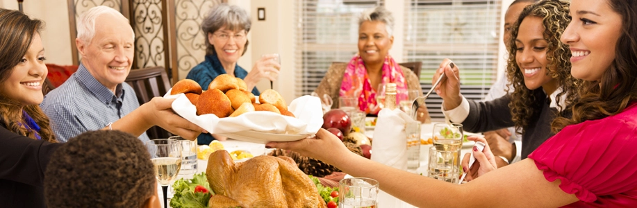 Family and friends gathered around holiday feast